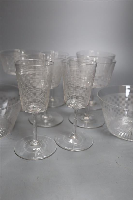 A suite of Edwardian etched drinking glasses and finger bowls, each decorated with a chequer design